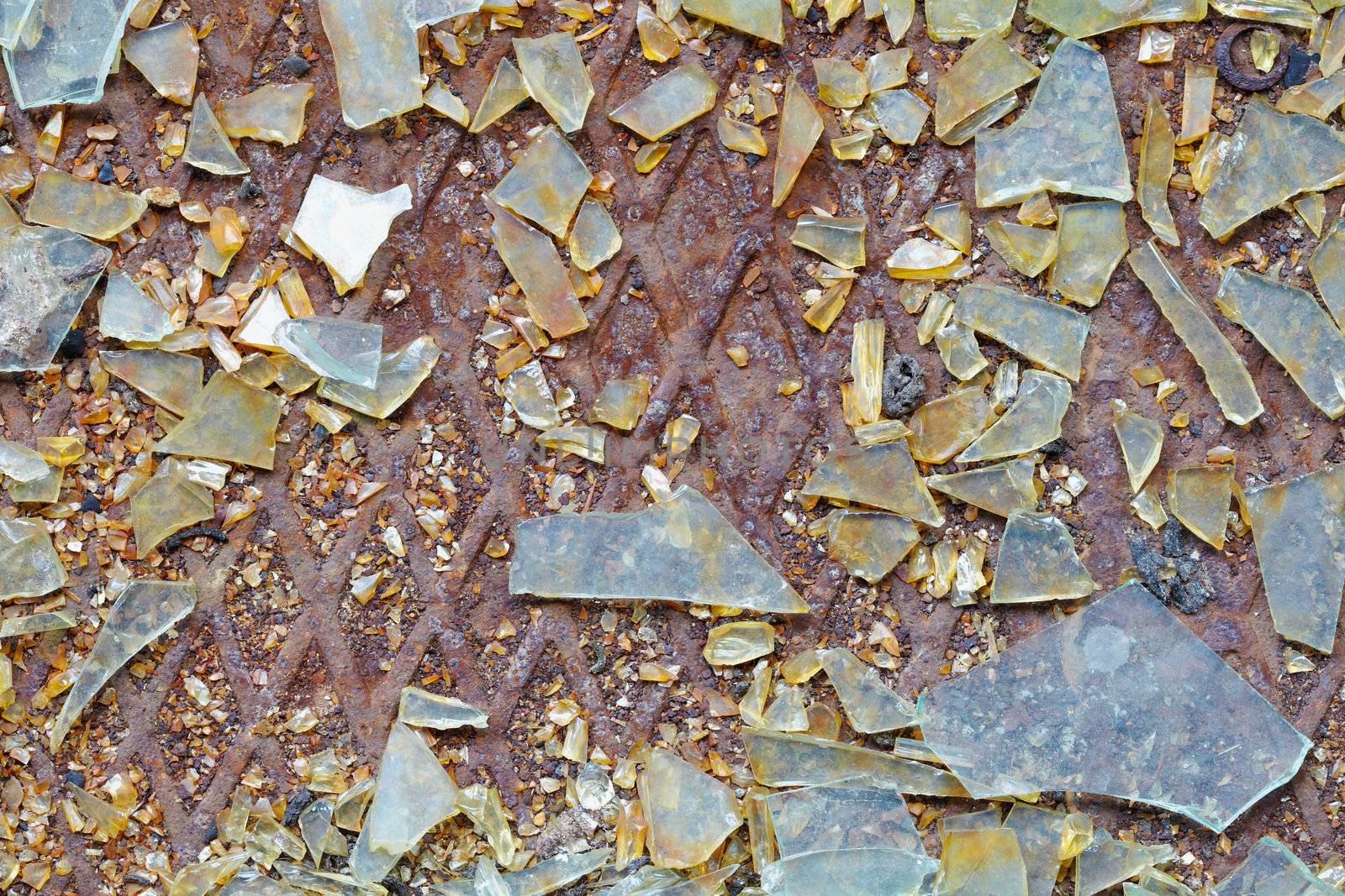 Dirty industrial background - broken glass on the steel floor