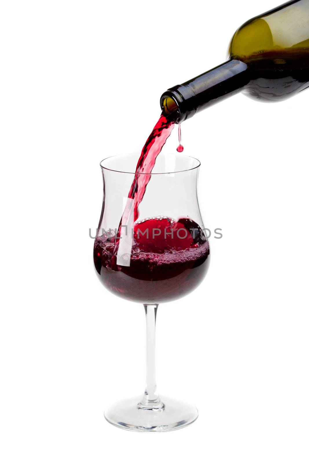 pouring red wine into a glass