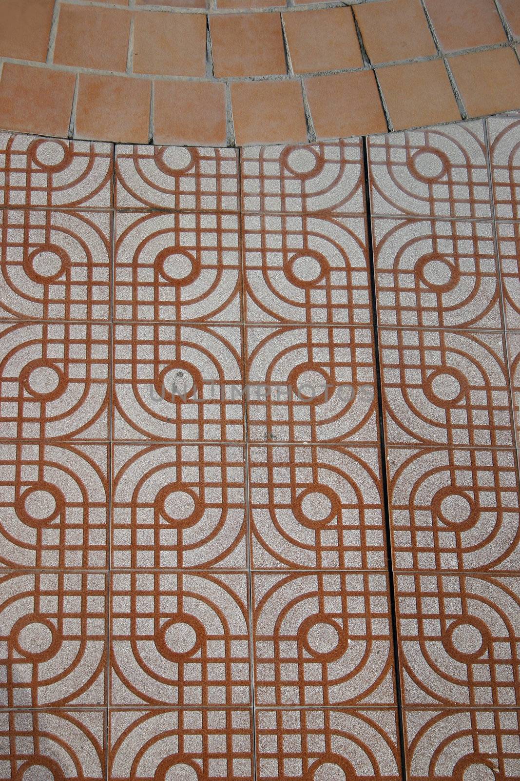tiles around a outside swimming pool