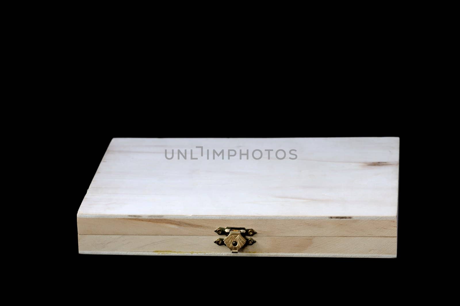 Empty thin wooden box on a black background.