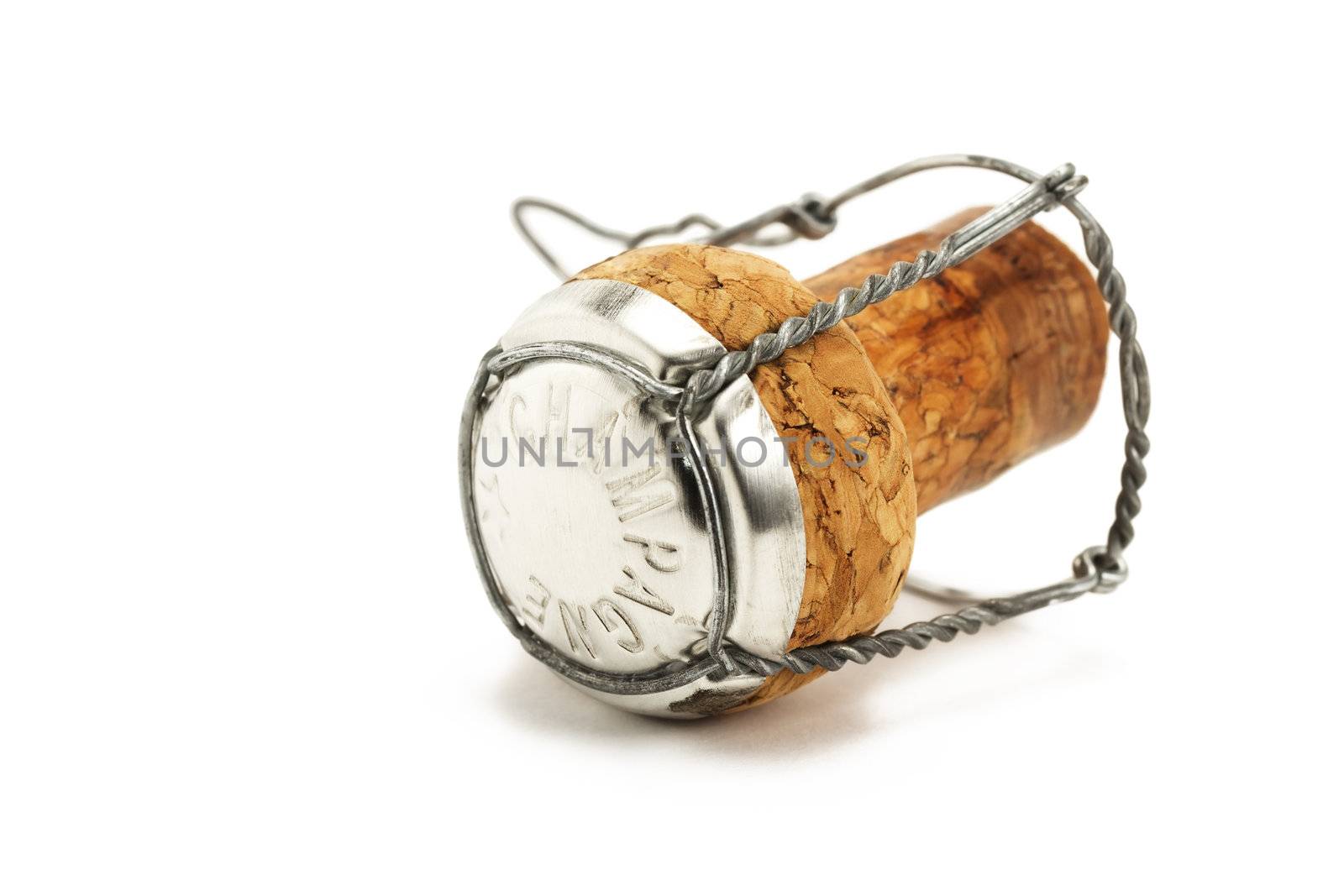 lying cork from a champagne bottle on white background