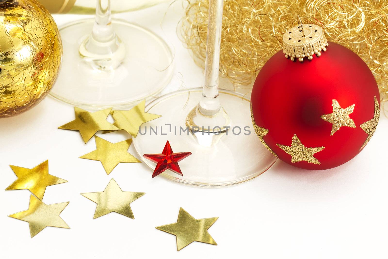 red and vintage christmas balls from top with angels hair, stars, champagne glass bottoms on white background