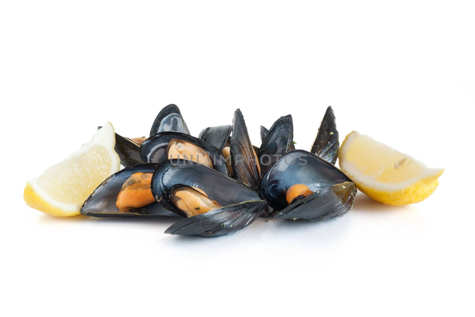 group of mussels boiled with lemon isolated on white background