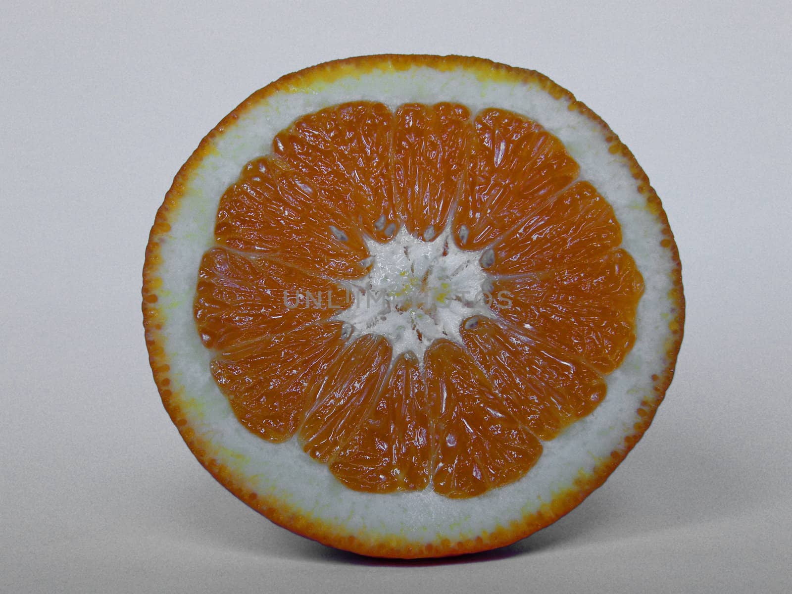 An orange on white table ready to eat
