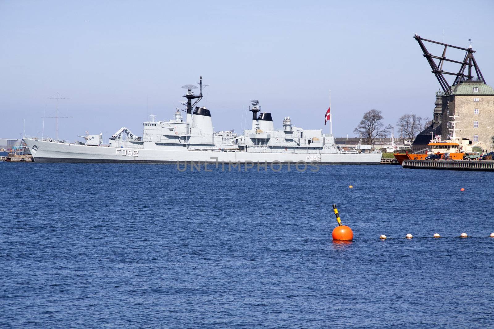 A war ship and a flag on half signaling death and sorrow