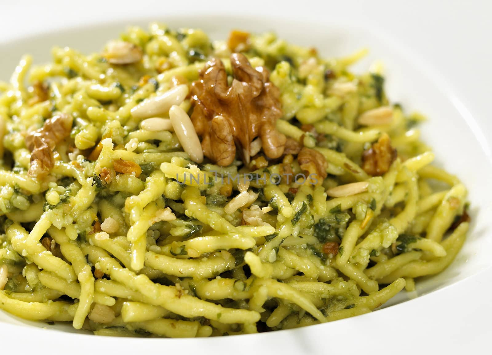 pasta plate with nuts isolated on white