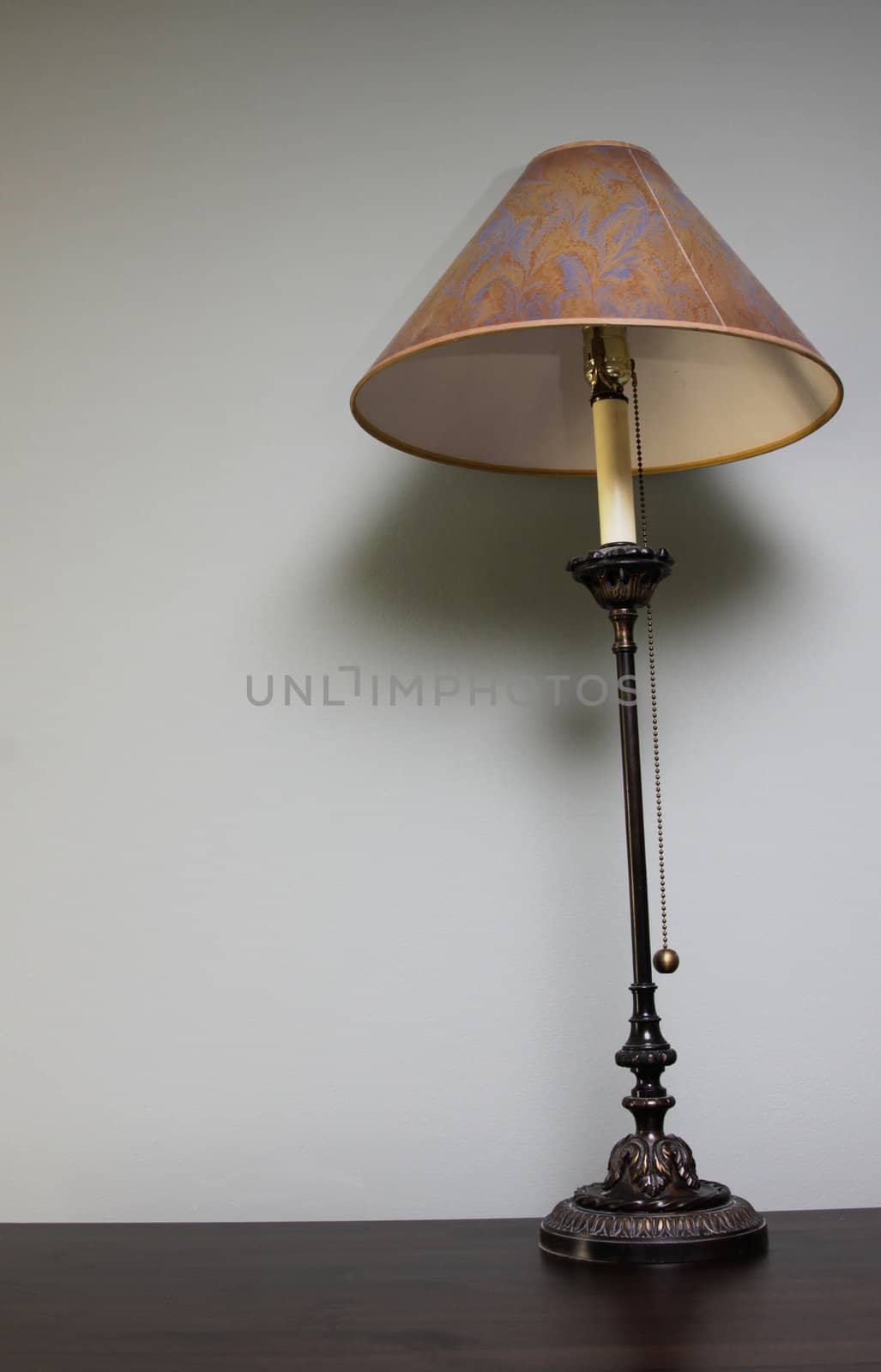 A lamp sitting on a table with copy-space.