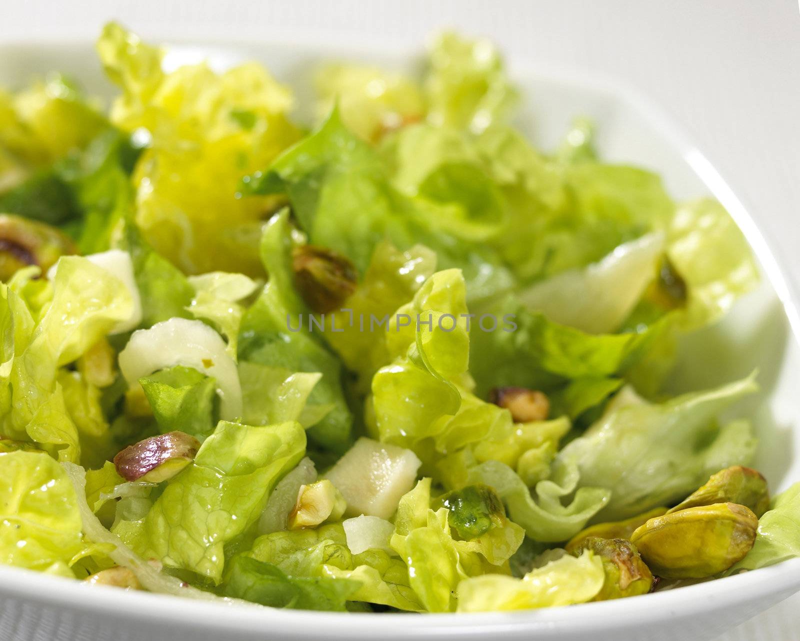 salad plate with nuts isolated on white