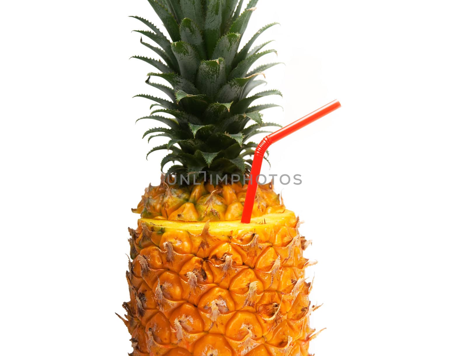 ripe pineapple cutted on top with red straw