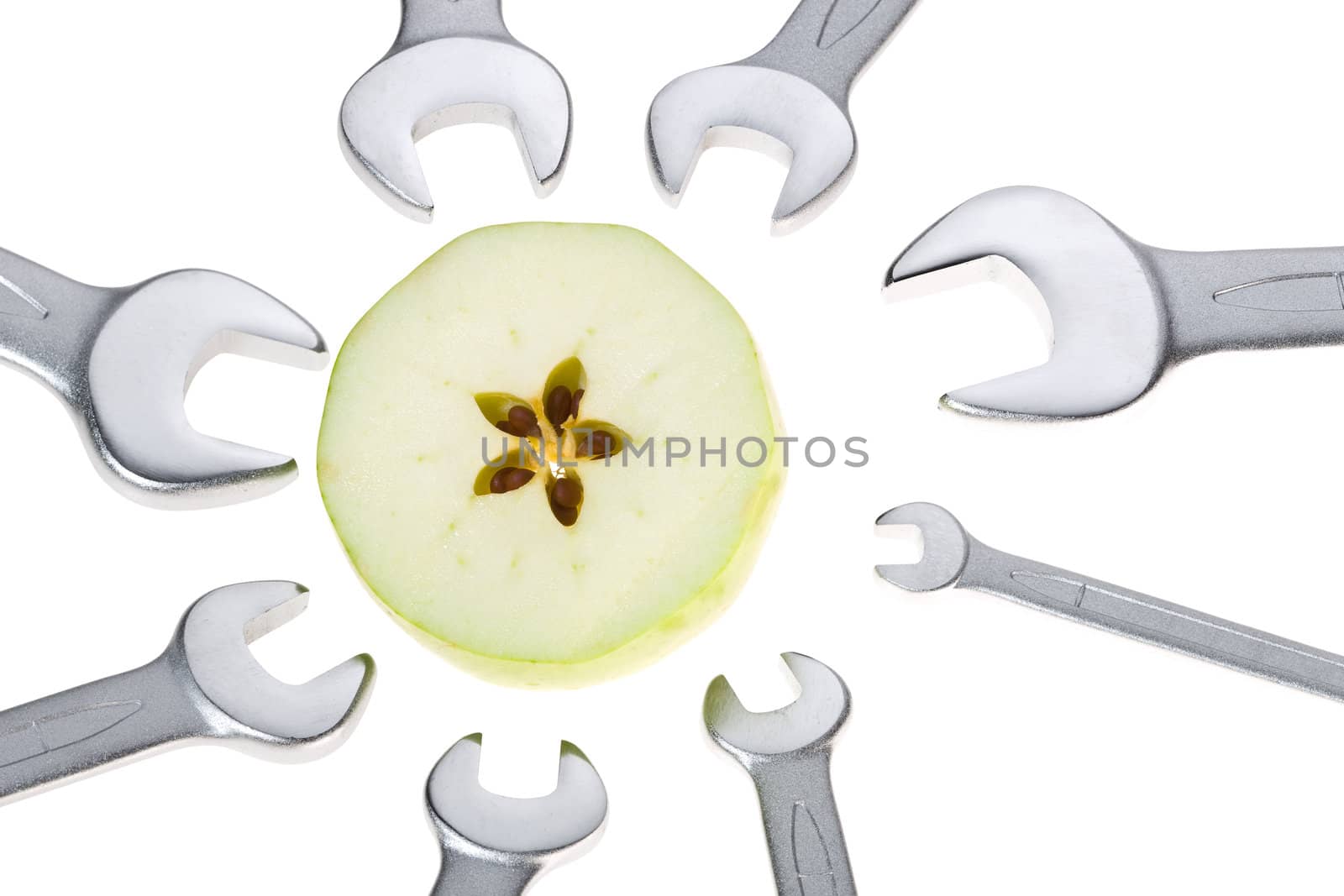 Cut apple and wrench isolated. Clipping path