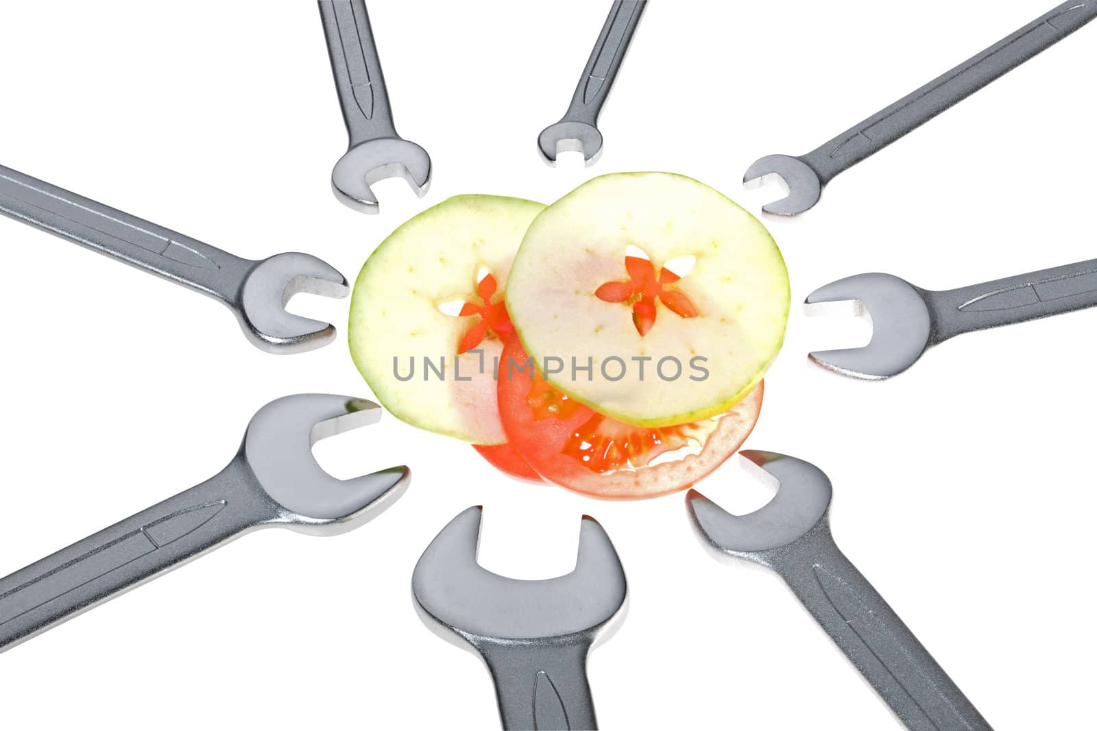 Cut apple, tomato and wrench isolated. Clipping path