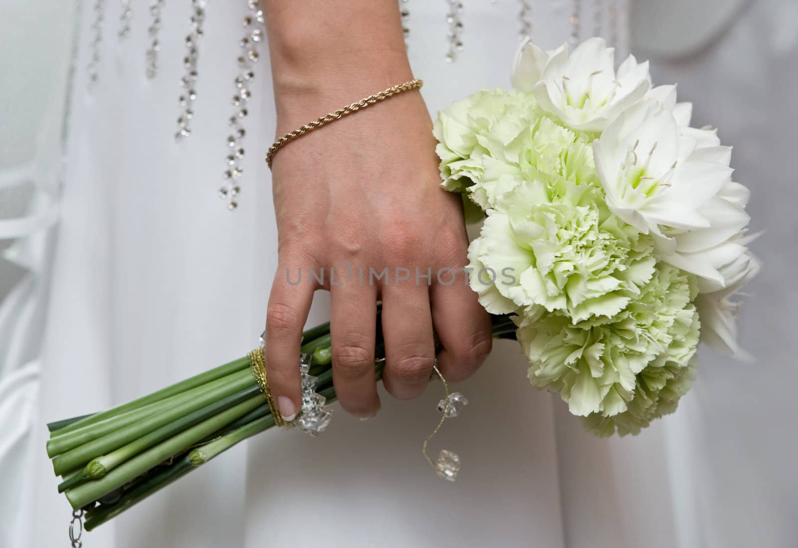 Bride hold bouquet with white natural flowers