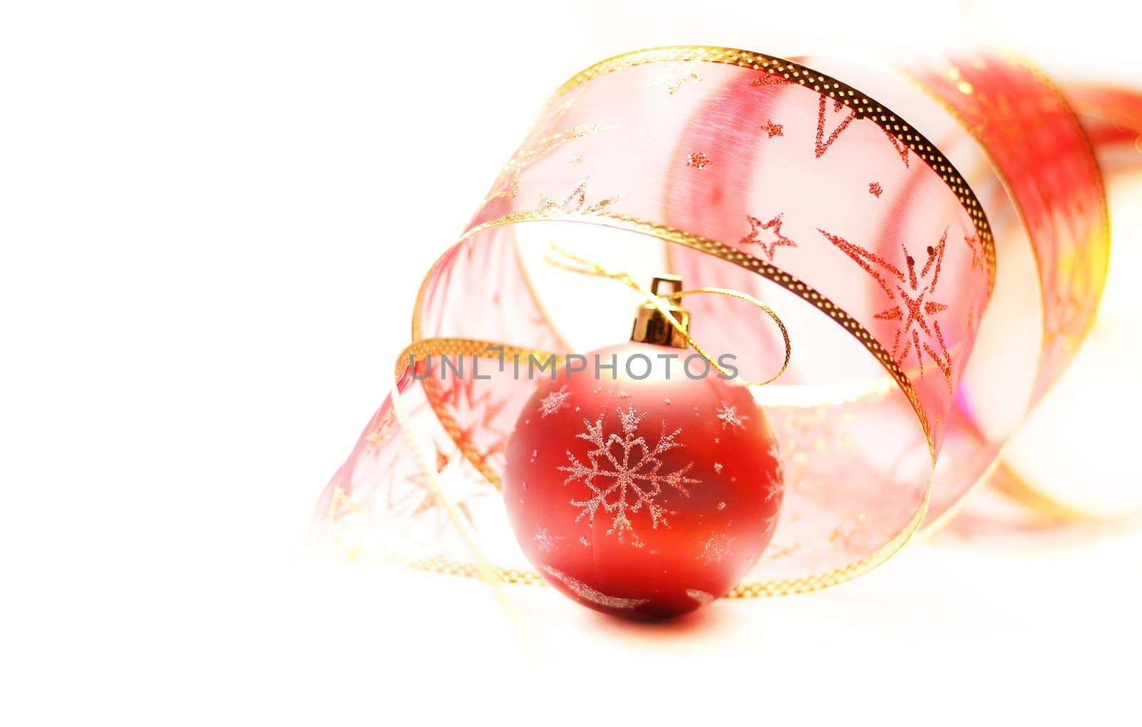 Red Christmas ball with rer ribbon isolated on white background