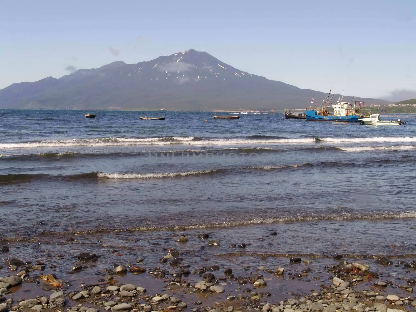 Landscapes of Kuriles, boats in the sea