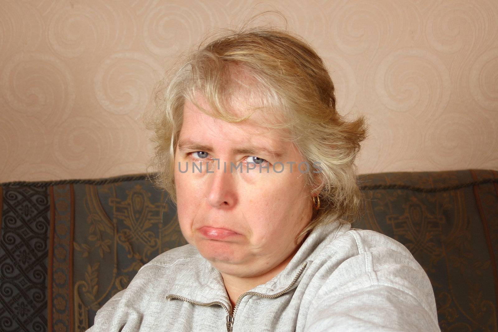 mature sad woman with space to the right