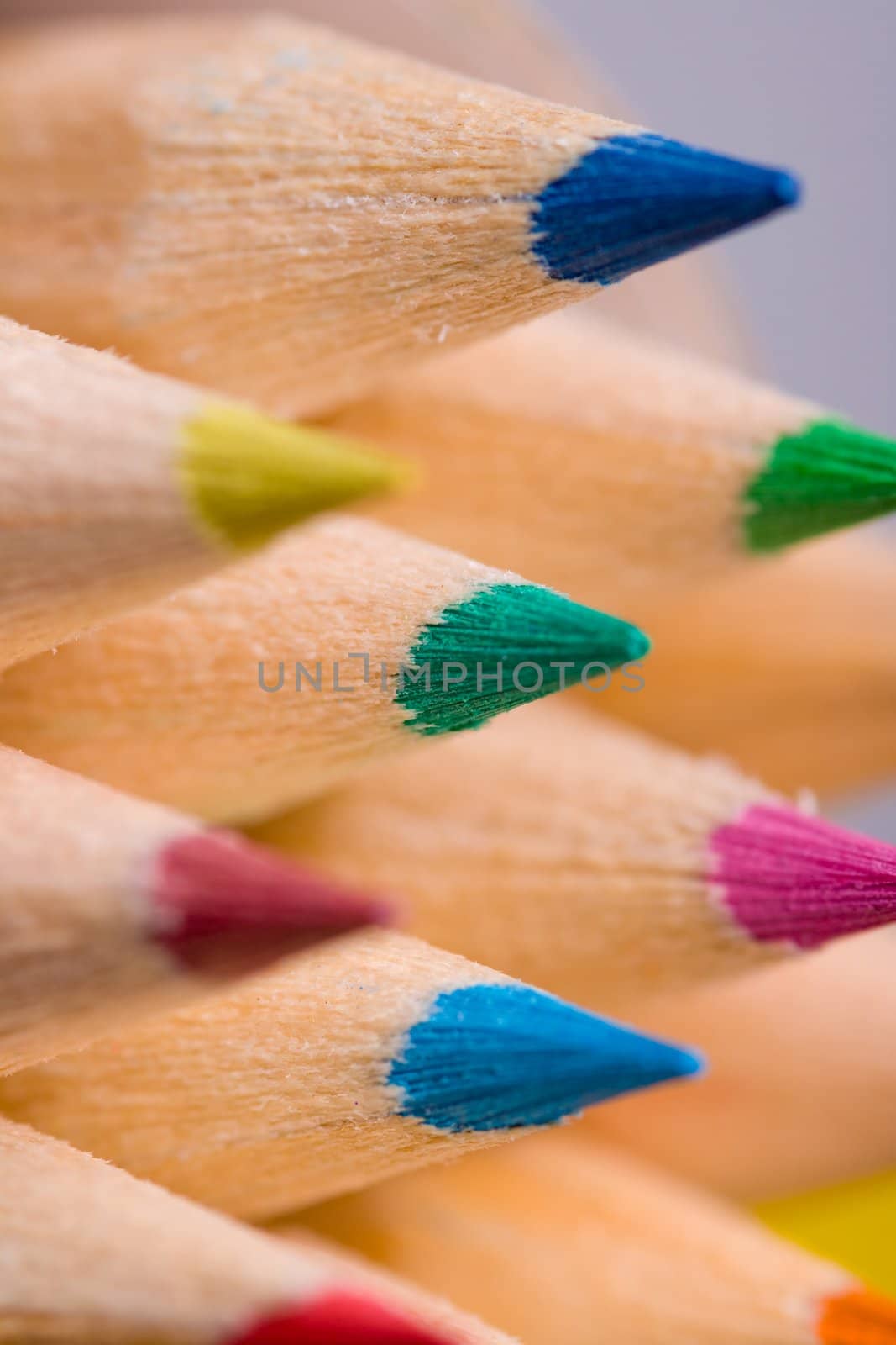 A composition of pencils of wood in a variety of colors 