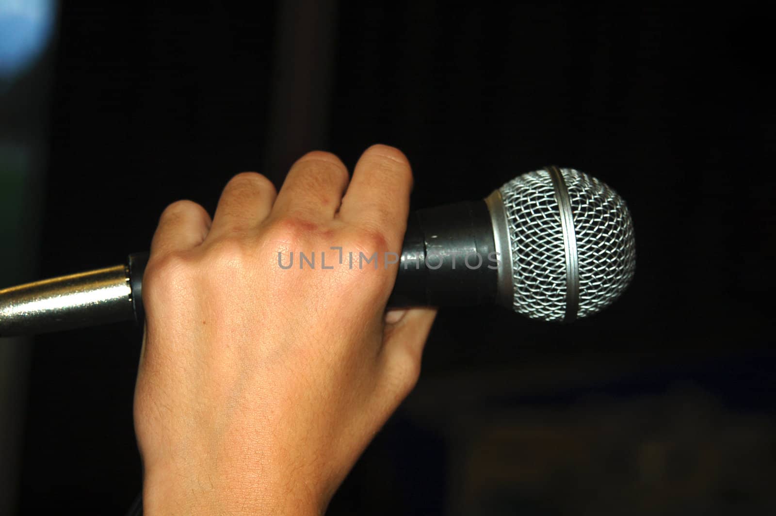 Hand Holding Vocal Microphone