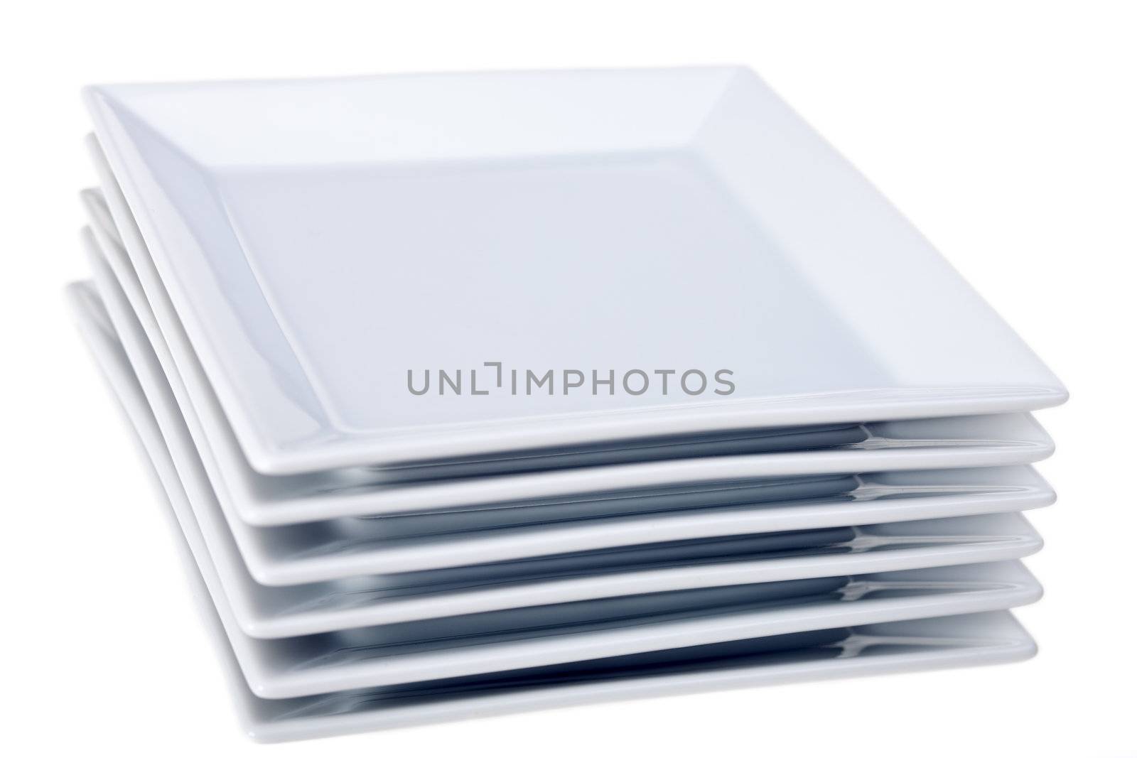 six white square plates isolated on white