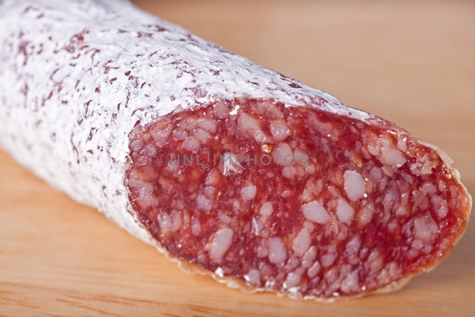 closeup of a salami sausage by bernjuer