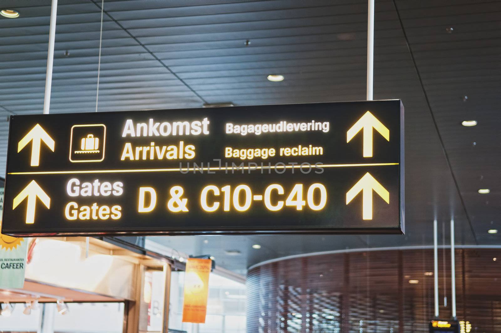 Flight information arrival departure board showing destinations, time and status in international airport