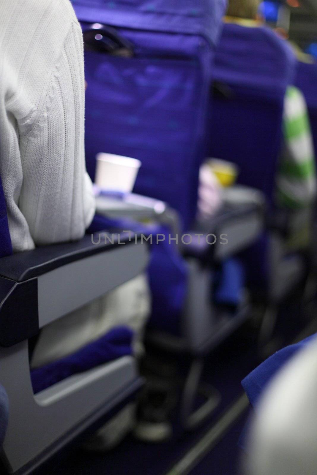 airplane seats in row by Yellowj