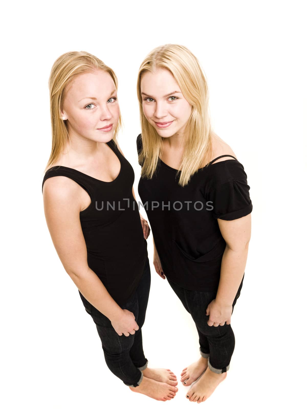 Two young women from above isolated on white background