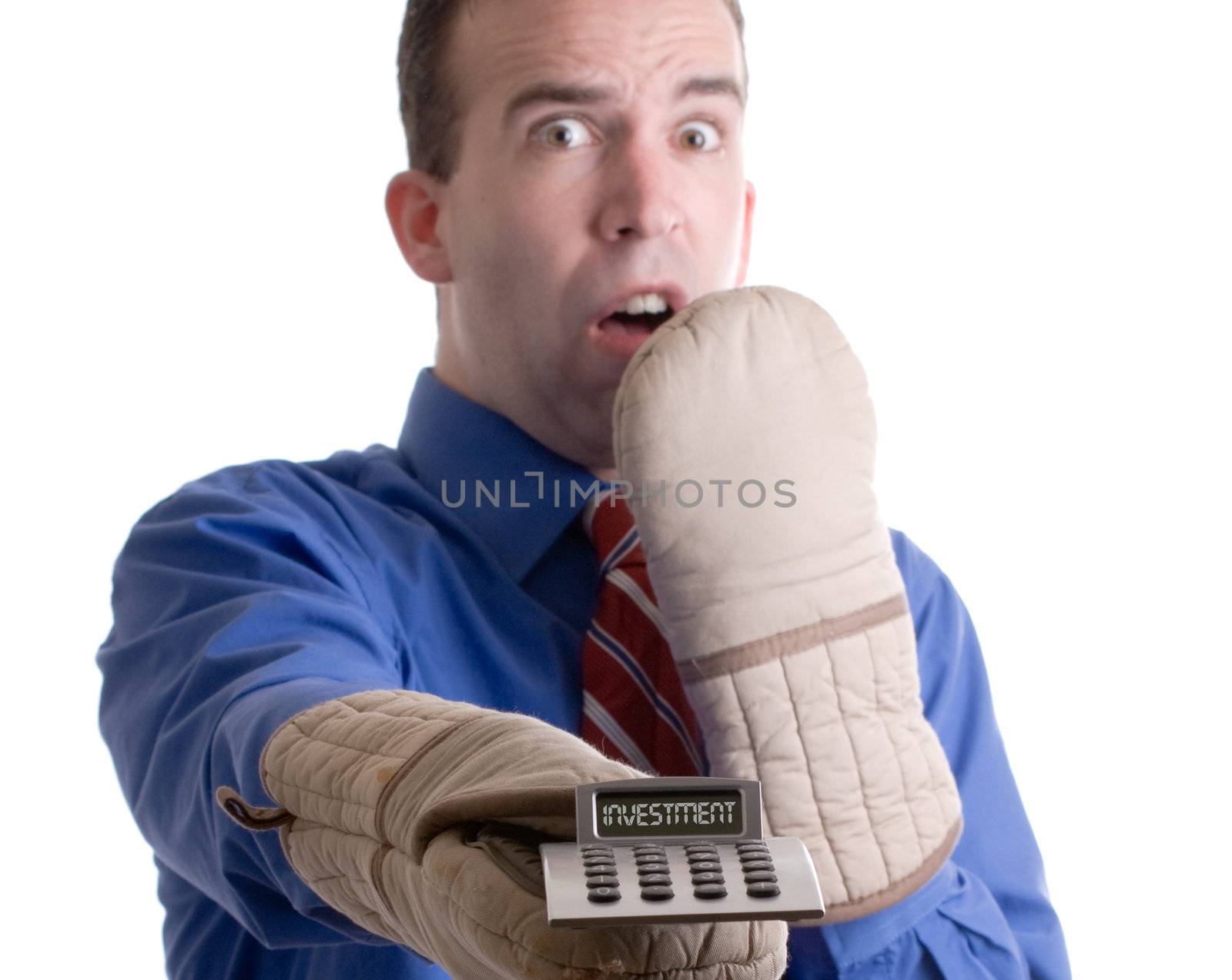 Concept image of a nervous banker holding onto his investment with oven mitts, isolated against a white background