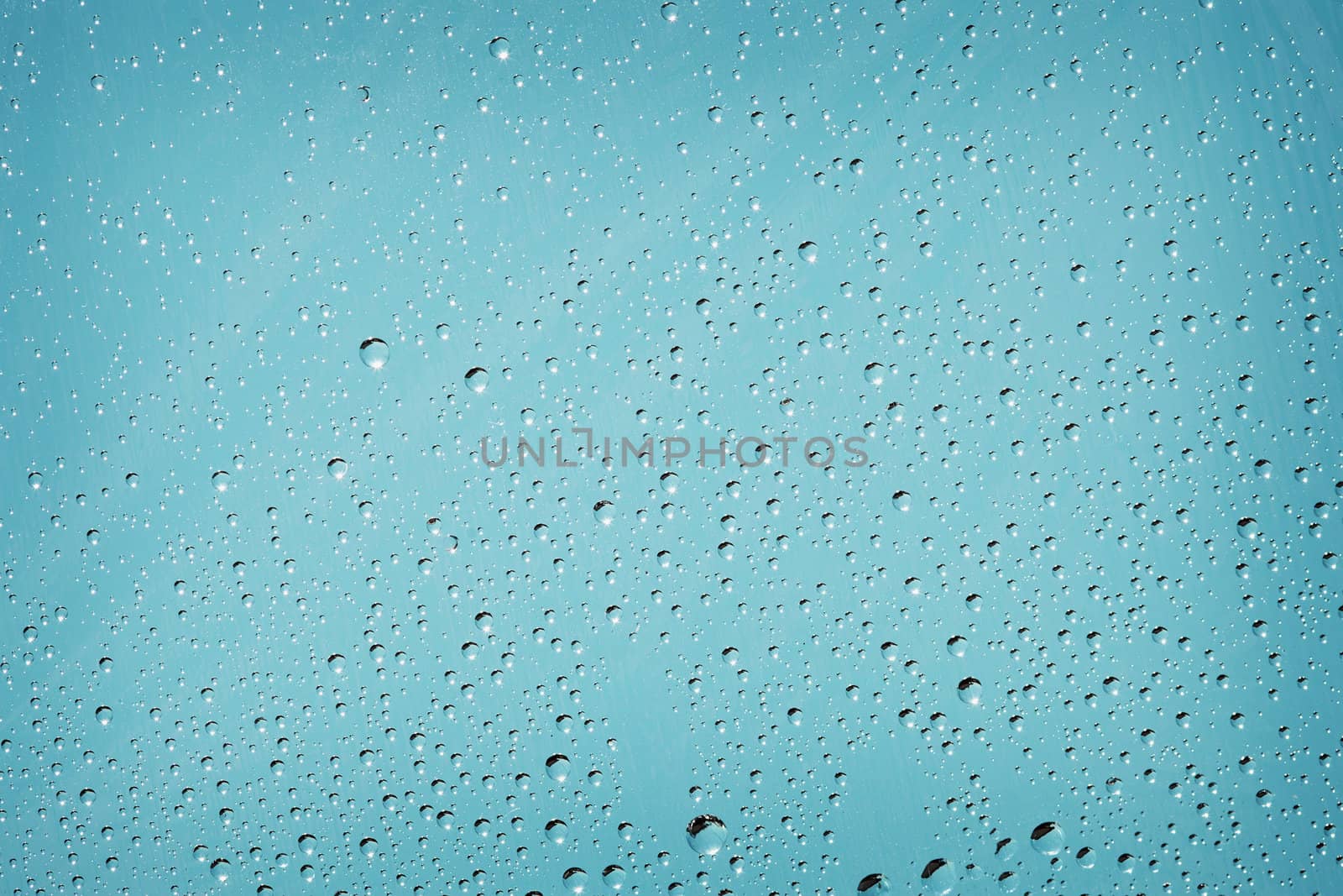 Blue background with tiny droplets of water