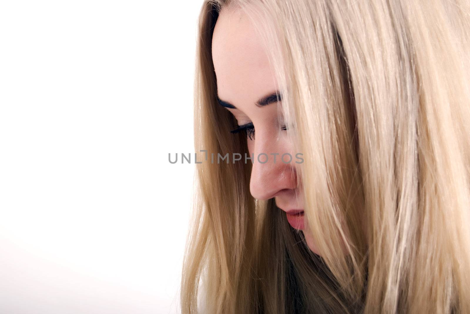 Portrait of a young sad blonde