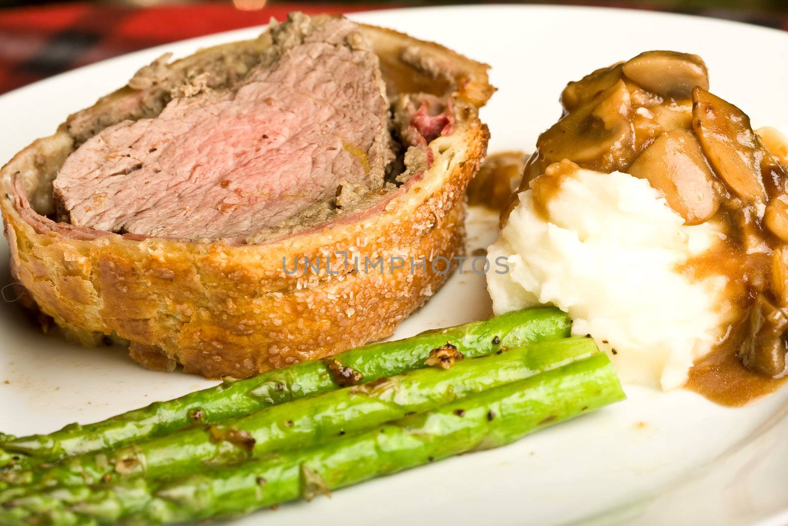 beef wellington tenderloin wrapped in ham mushrooms and puffy pastry