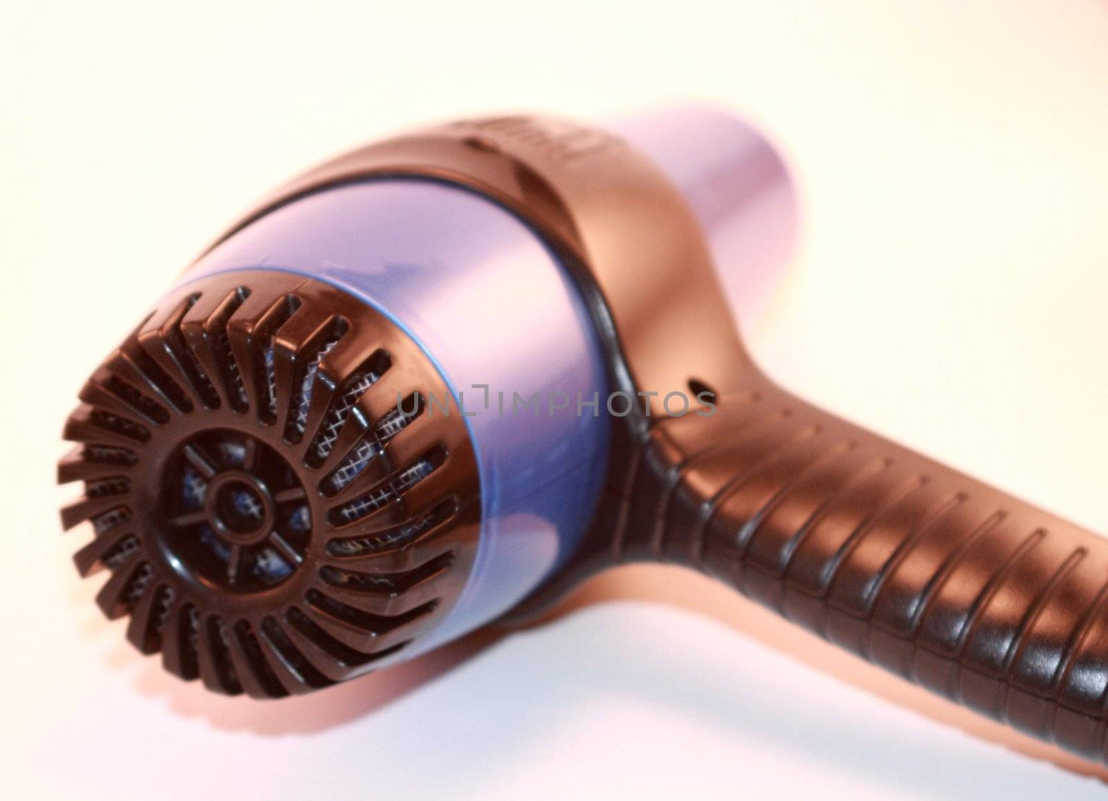 Blue and black electric hairdryer for hairstyling and beauty isolated on white background. Hair appliance for fashion and beauty.