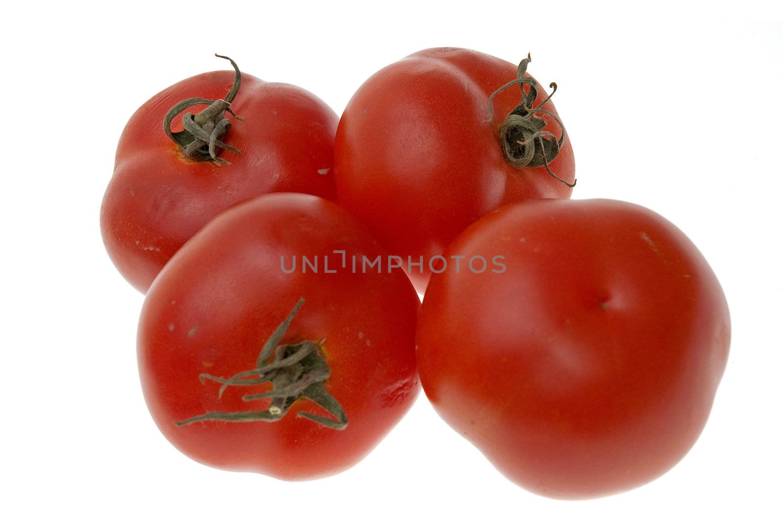 Four ripe tomatoes isolated on white background.
