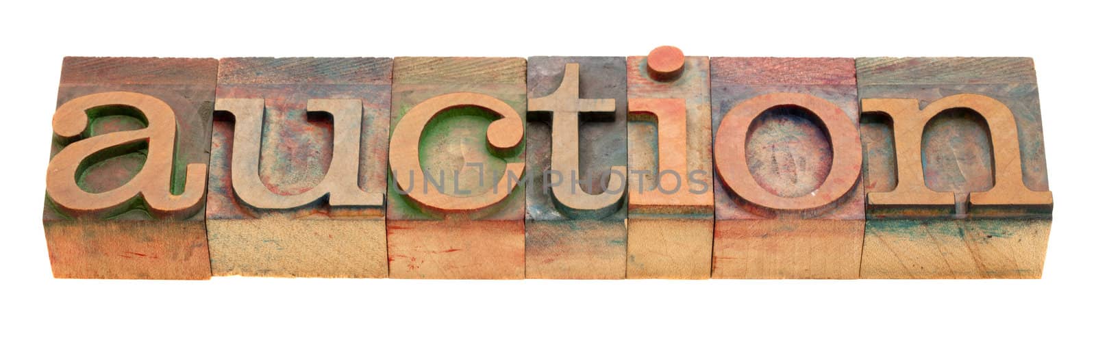 auction - word in vintage wooden letterpress printing blocks isolated on white