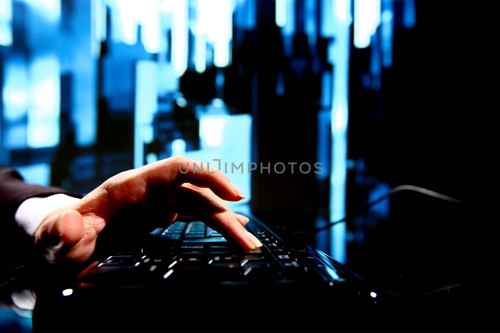 reseller work on keyboard skyscrapers on background