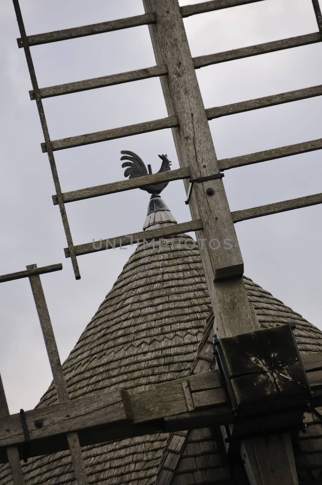 Weathercock of vintage wind mill in Brittany, France