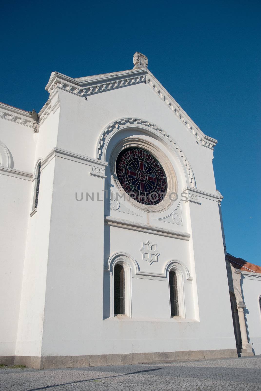 Portuguese church view agains blue clear sky.