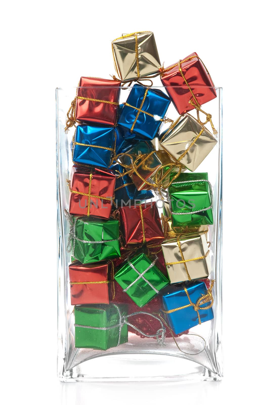 Christmas decorative presents in glass jar isolated on white background.