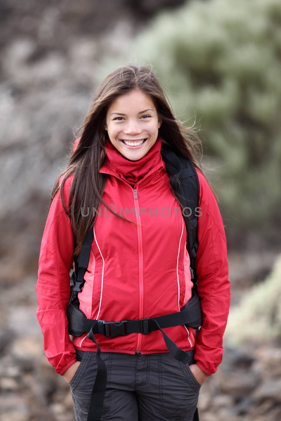 Outdoors woman portrait of young and beautiful hiking woman - very fresh outdoor look. 