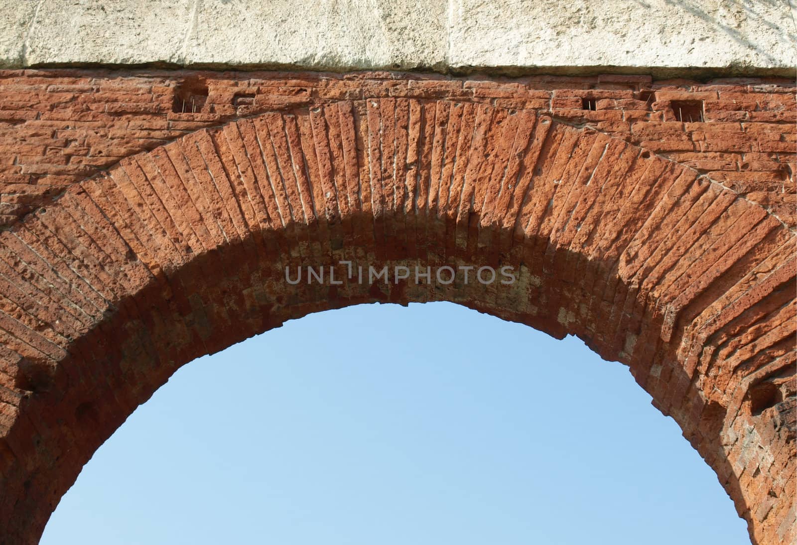 Roman arch with blue sky as copy space