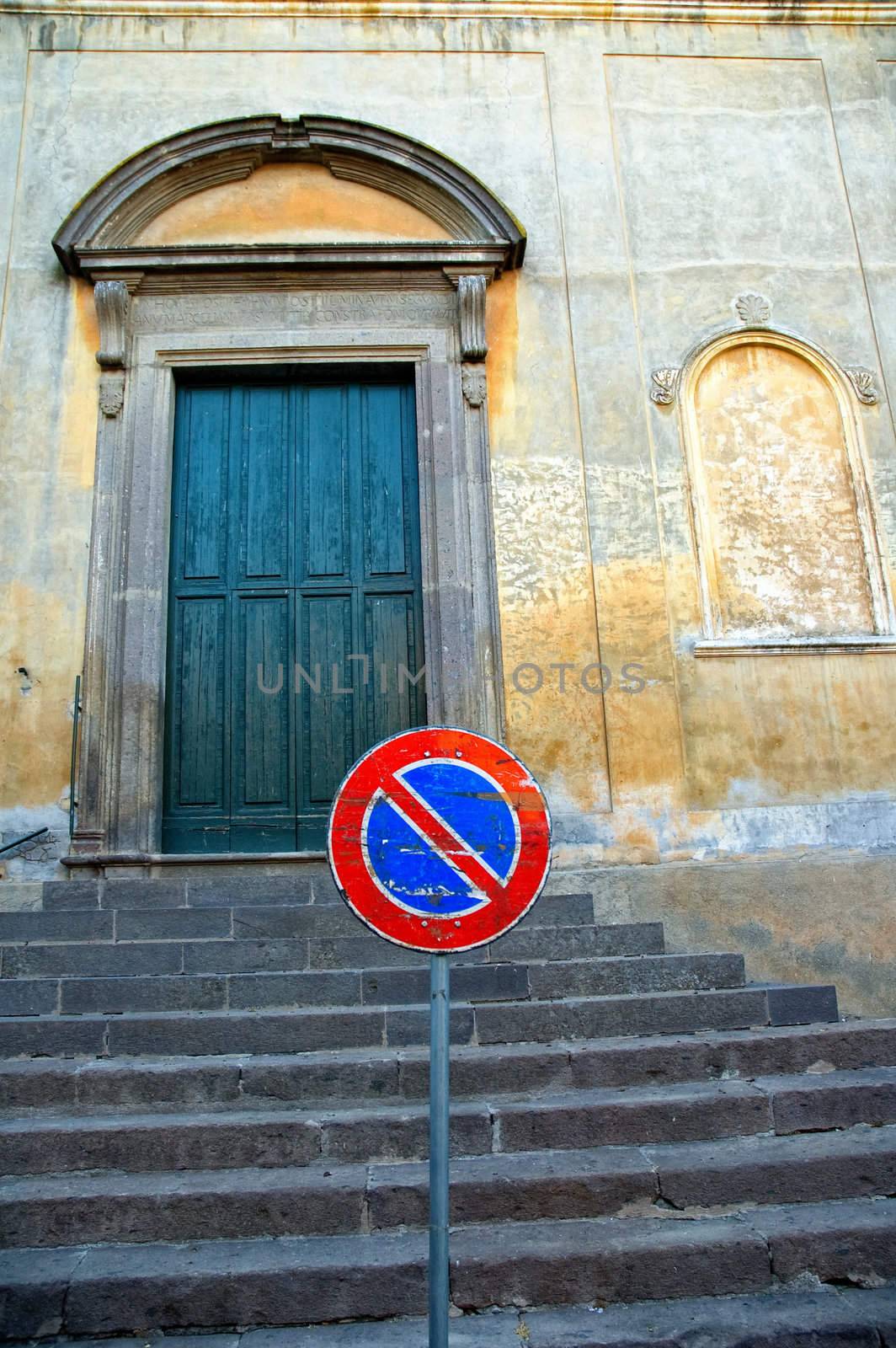 No parking sign in front of Italian church steps