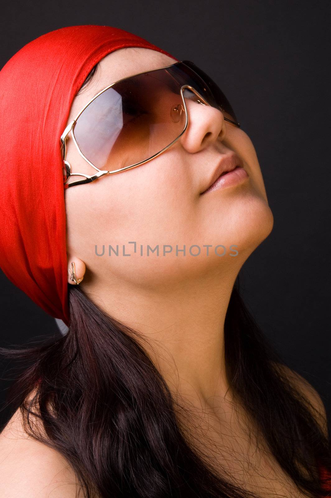 The girl in a red scarf and glasses by andyphoto