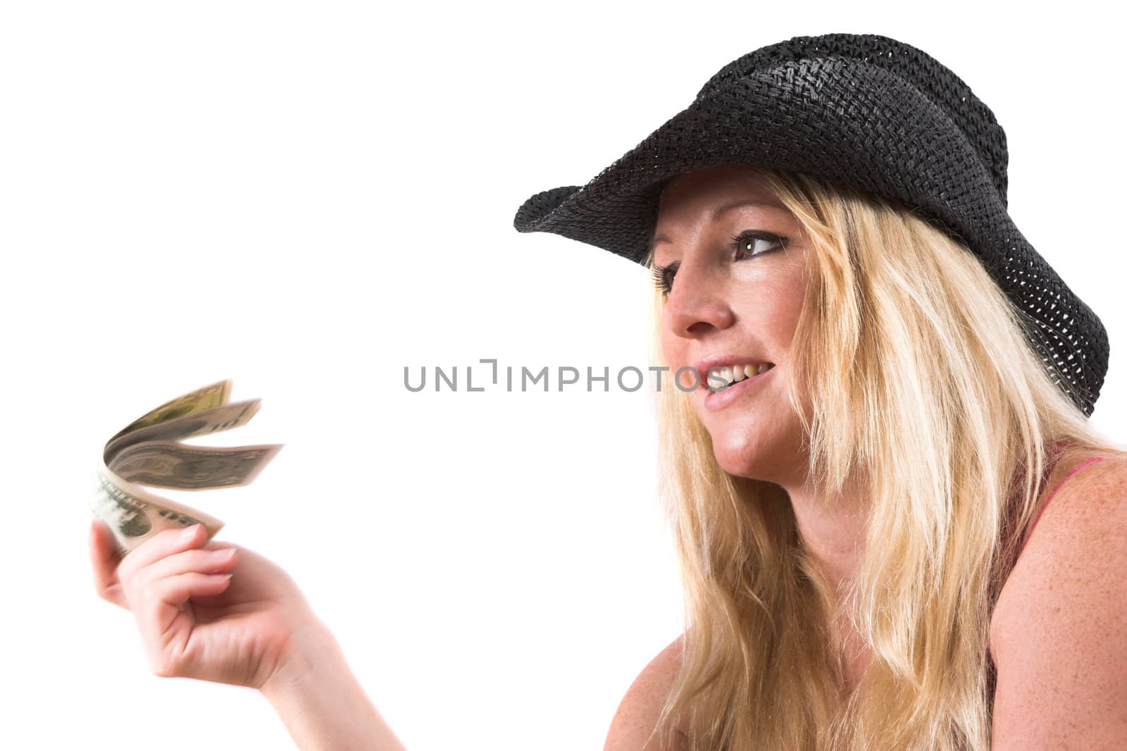 Pretty blond woman holding out some dollars