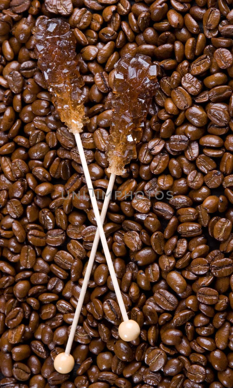 Close-up of offee beans closeup with brown sugar crystals