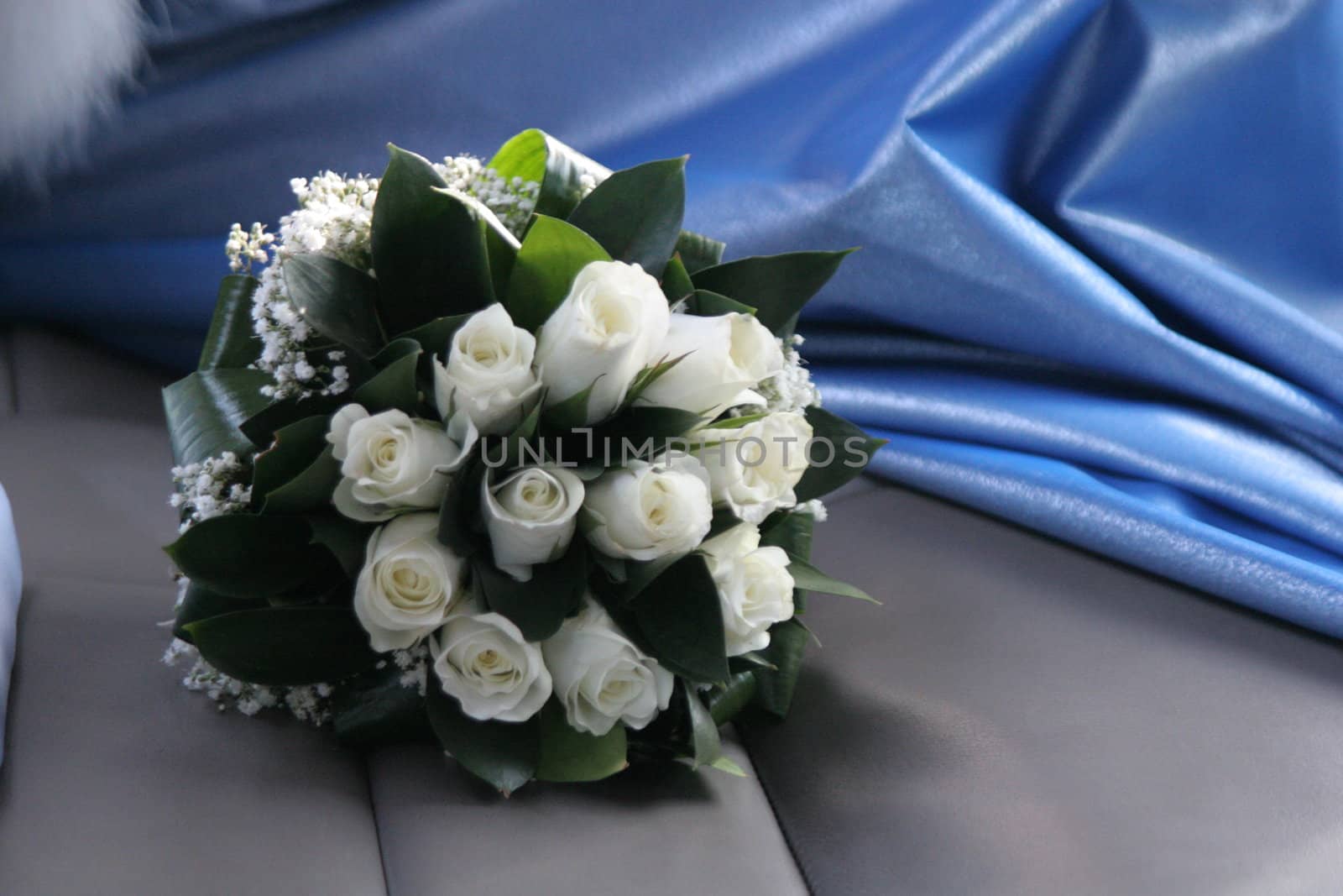 Bride bouquet and blue fabric