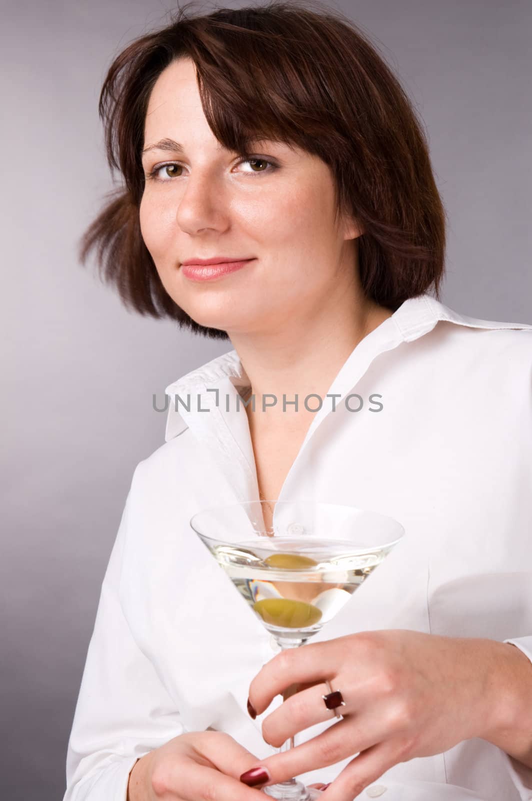The woman with a glass of martini by andyphoto