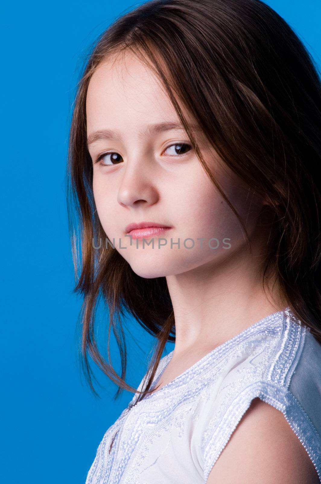 The girl of ten years on blue background