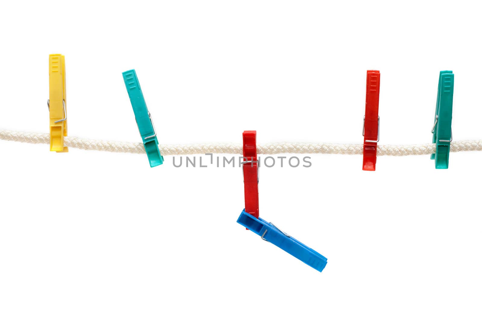 Colour clothes-pegs hung on linen rope, insulated on white background