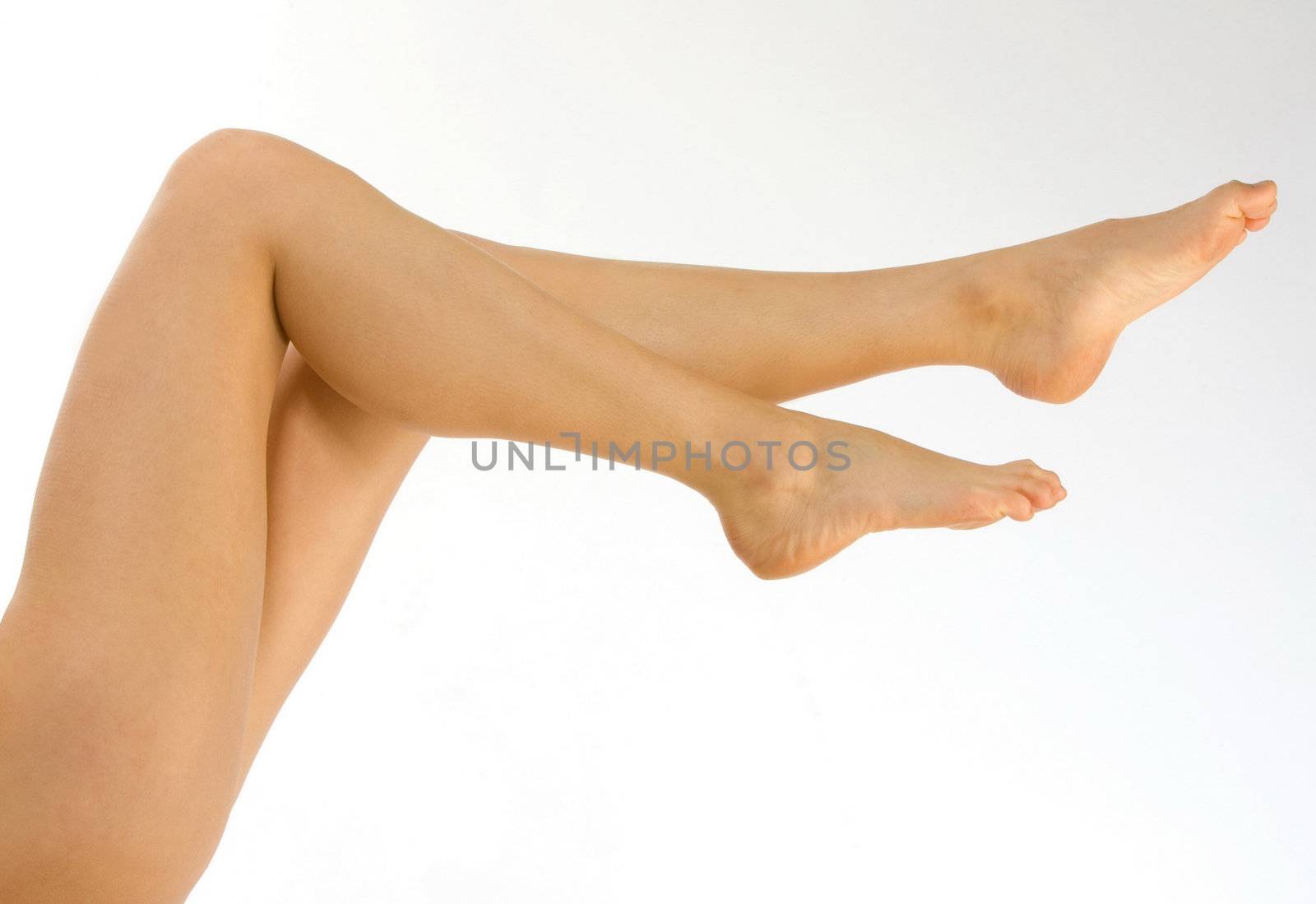 Beautiful legs of a woman isolated on white background