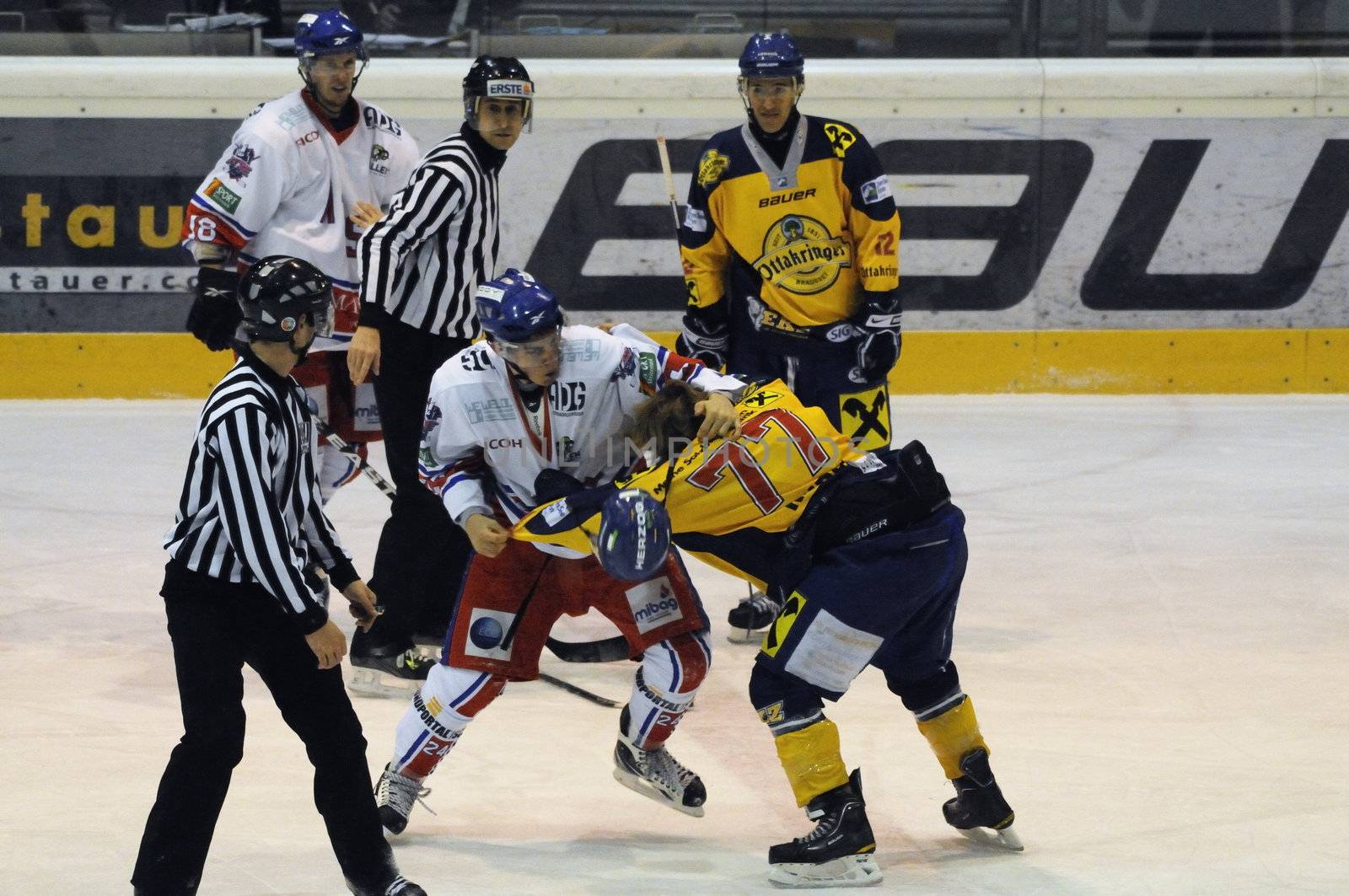 ZELL AM SEE, AUSTRIA - NOVEMBER 30: Austrian National League. Fight between Volker Keidl and Florian Graf. Game EK Zell am See vs. ATSE Graz (Result 0-4) on November 30, 2010, at hockey rink of Zell am See