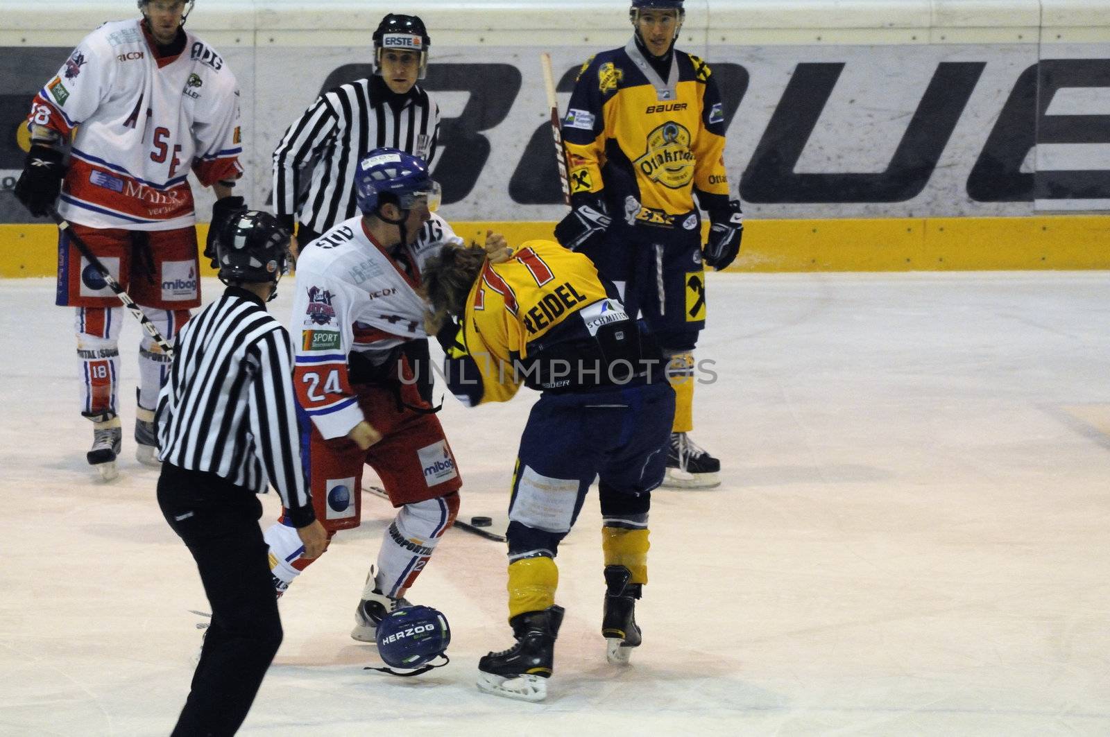 ZELL AM SEE, AUSTRIA - NOVEMBER 30: Austrian National League. Fight between Volker Keidl and Florian Graf. Game EK Zell am See vs. ATSE Graz (Result 0-4) on November 30, 2010, at hockey rink of Zell am See